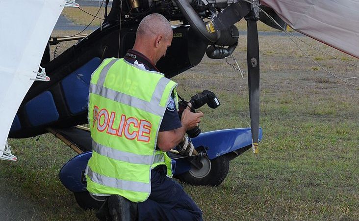 Police attend the scene of a microlight crash at the Hervey Bay airport. Police attend the scene of a microlight crash at the Hervey Bay airport.